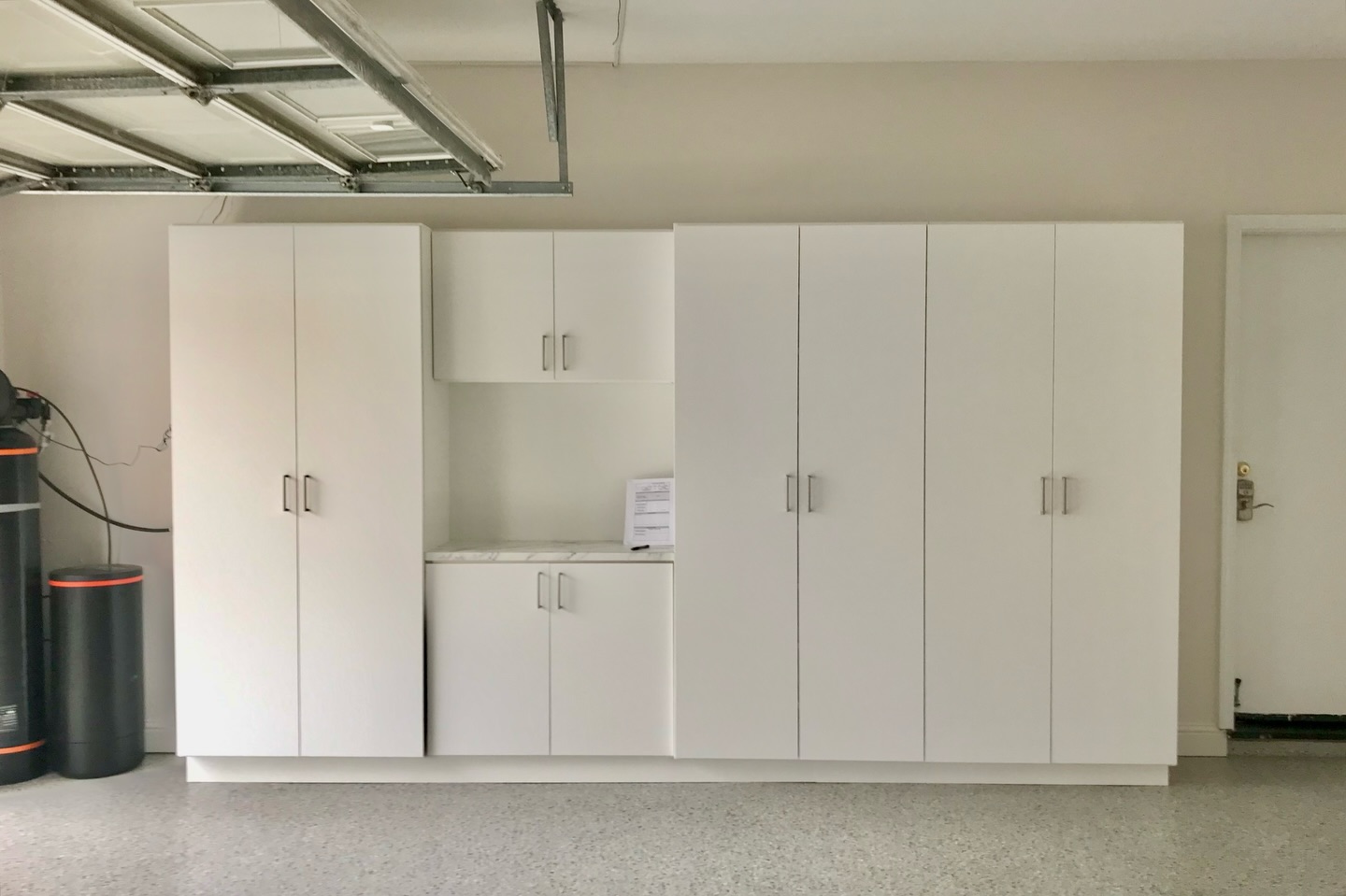 Full-wall storage cabinets with countertop
