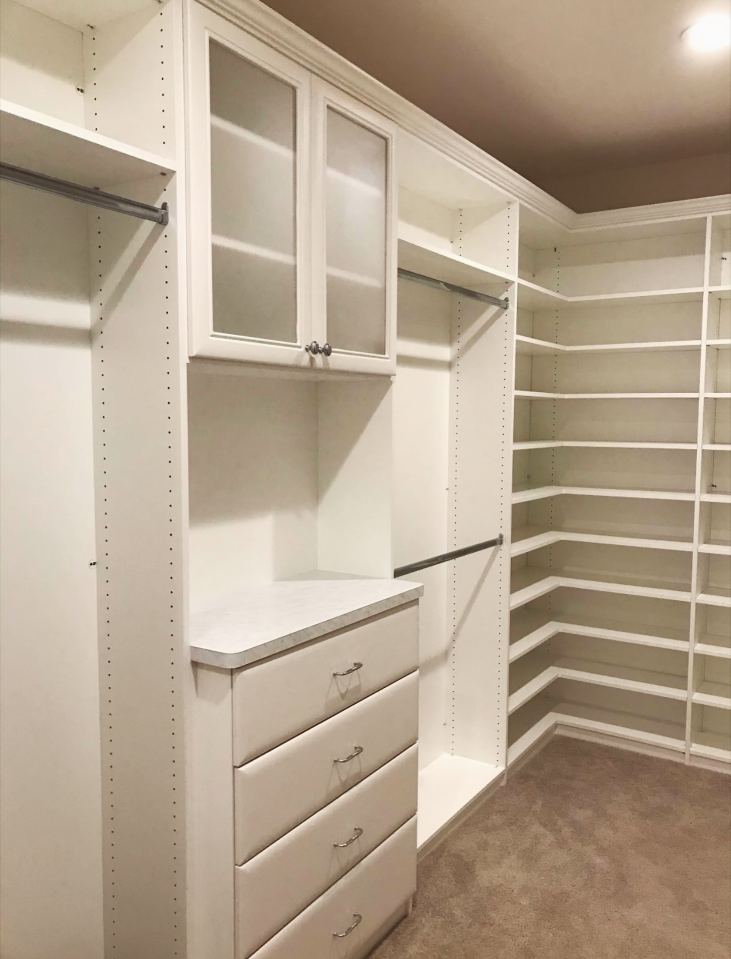 Corner walk-in with glass cabinets